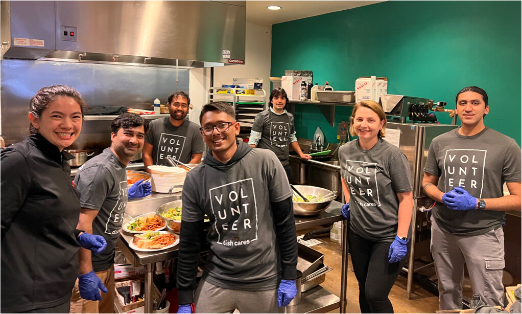 Diverse group of DISH employees smiling and volunteering at work