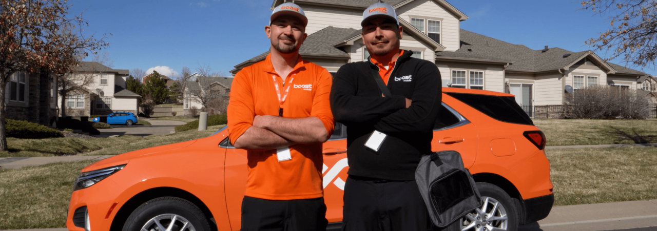 An image of technicians supporting customers with Boost Mobile products.