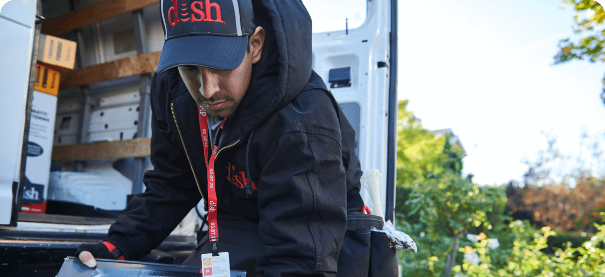 DISH installation technician using his company-provided tools