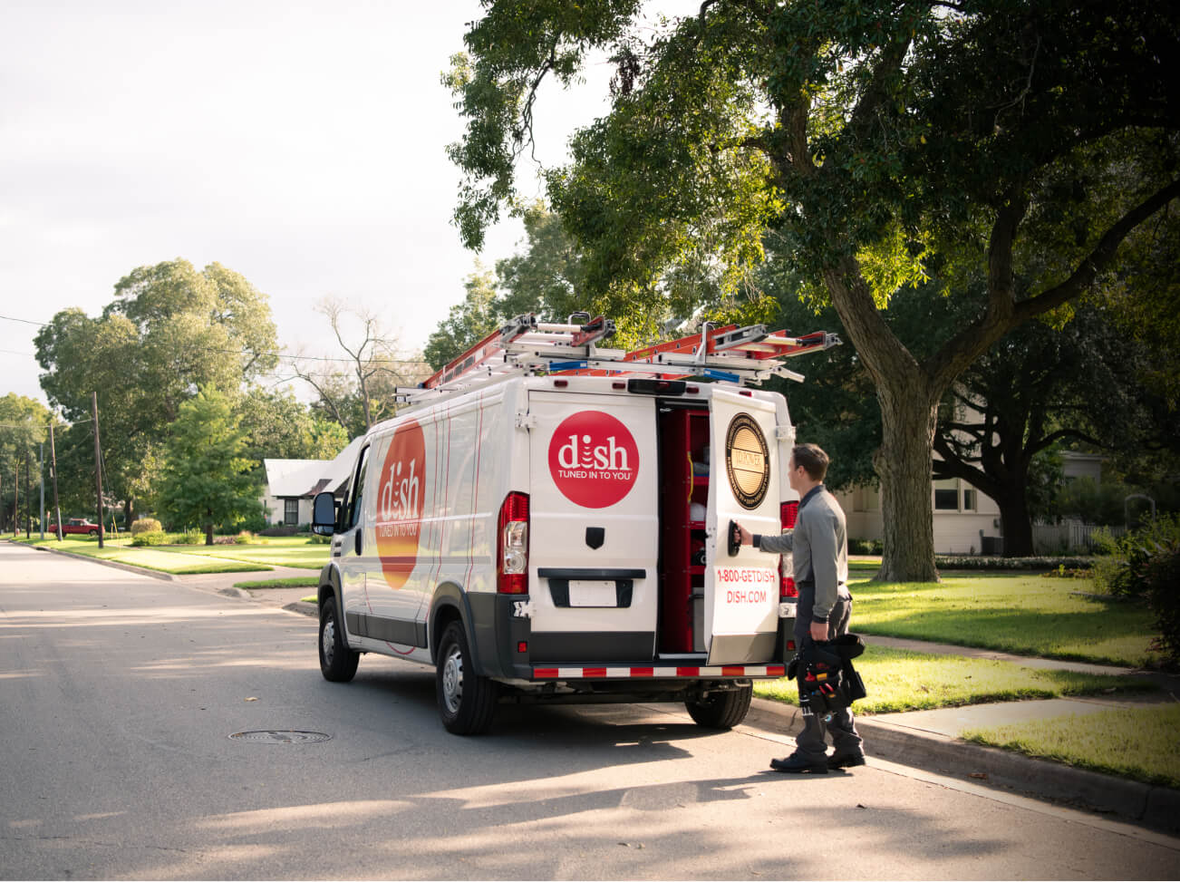 DISH Installation technician getting out of DISH van with provided tools working job hiring near you